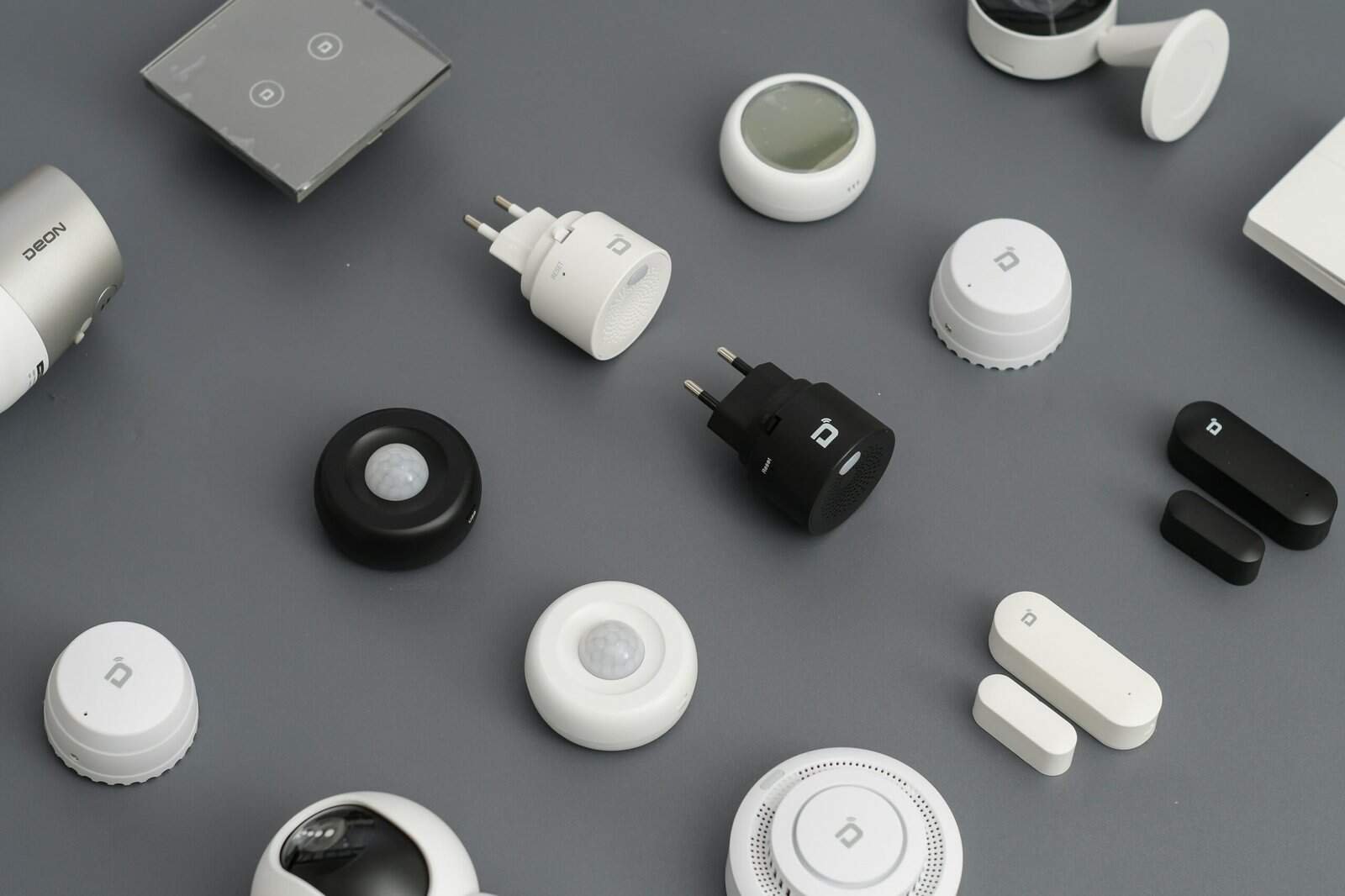 Collection of affordable smart home gadgets including sensors, plugs, and controllers for modern aut.