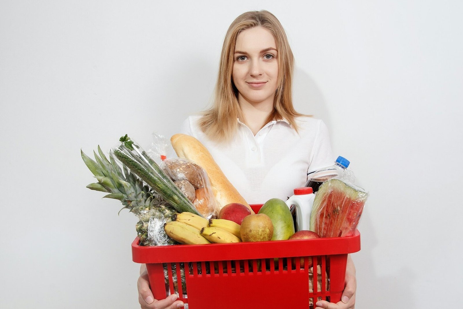 Grocery shopping on a budget: family with a shopping list in a supermarket