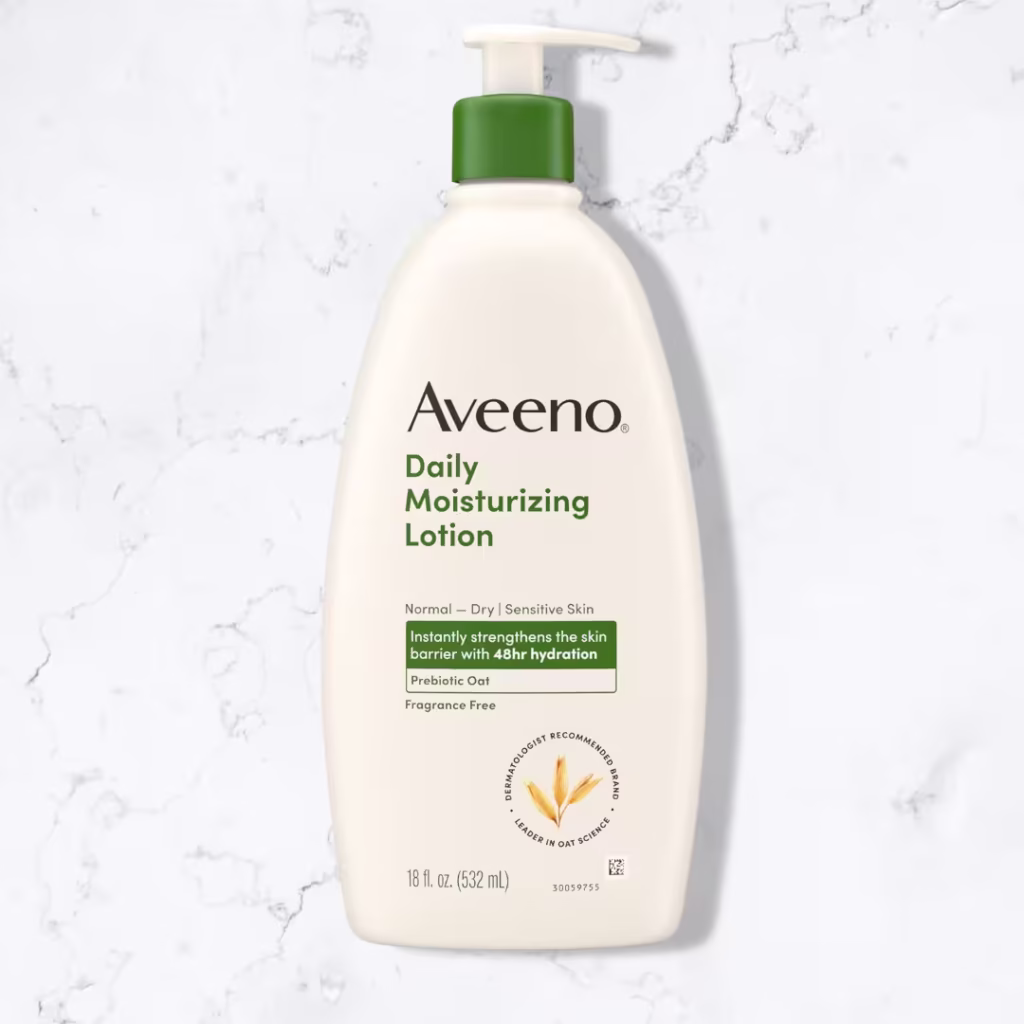 Aveeno Daily Moisturizing Body Lotion for Normal to Dry Skin, Moisturizer with Soothing Prebiotic Oat, Non Greasy, Non Comedogenic, Fragrance Free Body Lotion for Women & Men, 18 Fl Oz, product shot on a marble floor.