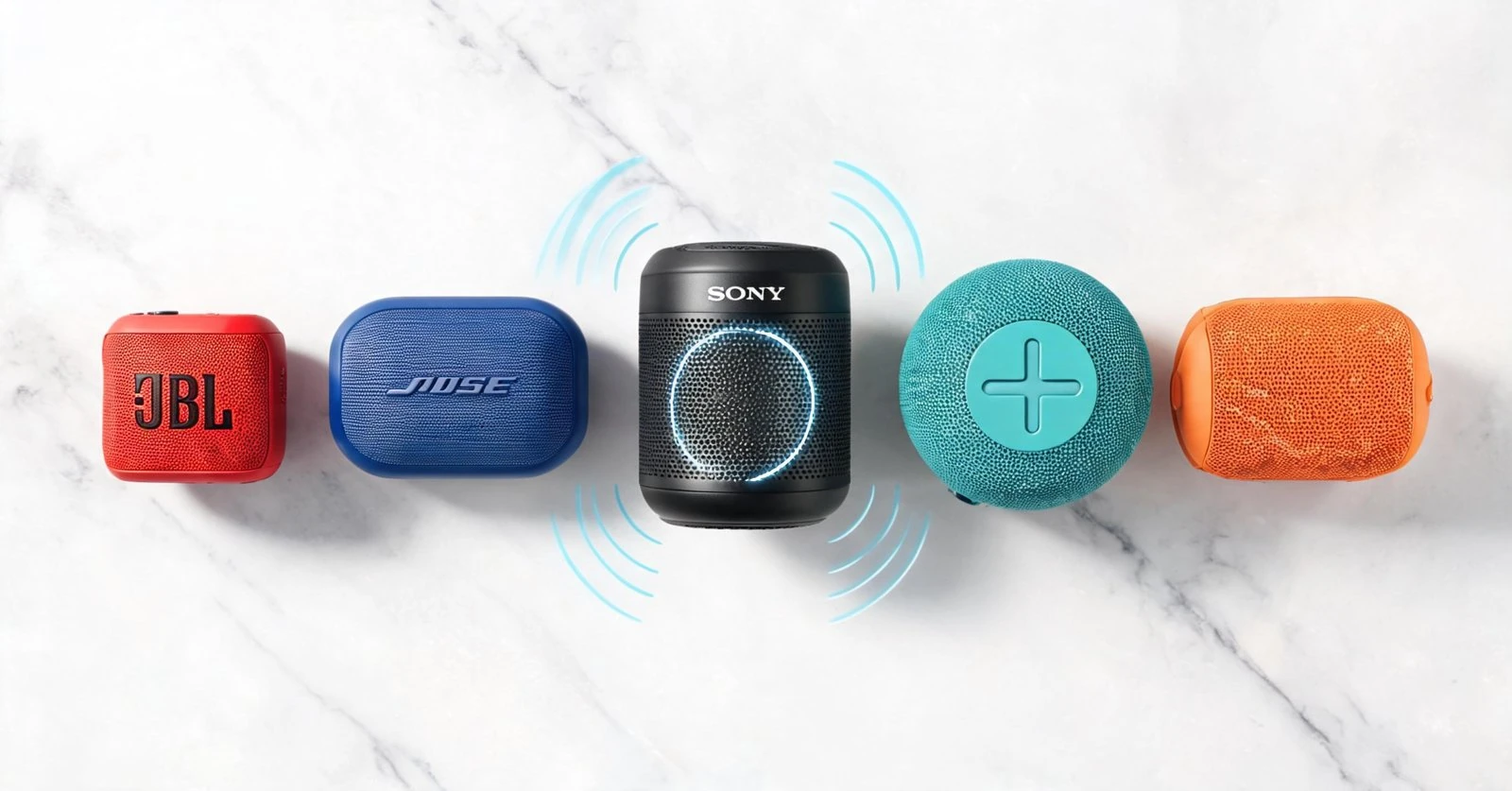 Wireless Bluetooth speakers in various colors on marble surface.