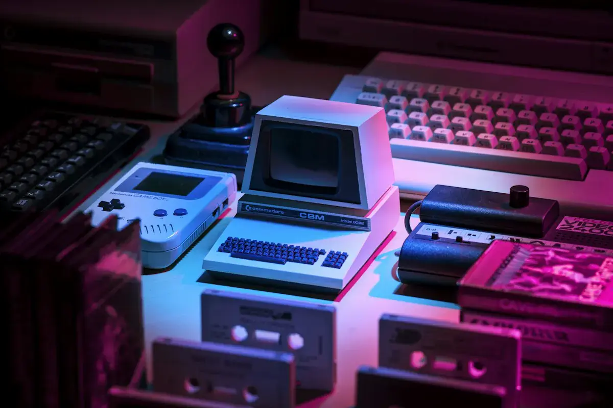 RGBIC LED strip light glow behind a retro gaming console on a wooden shelf